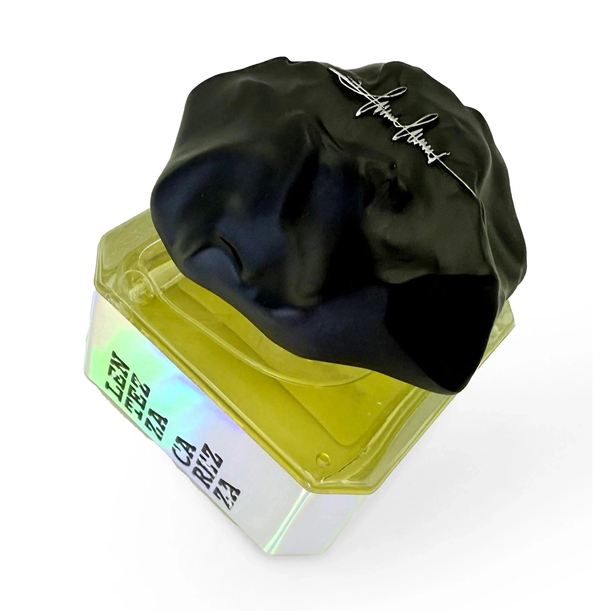 Filippo Sorcinelli Lentezza Carezza perfume bottle showing golden liquid and engraved signature cap