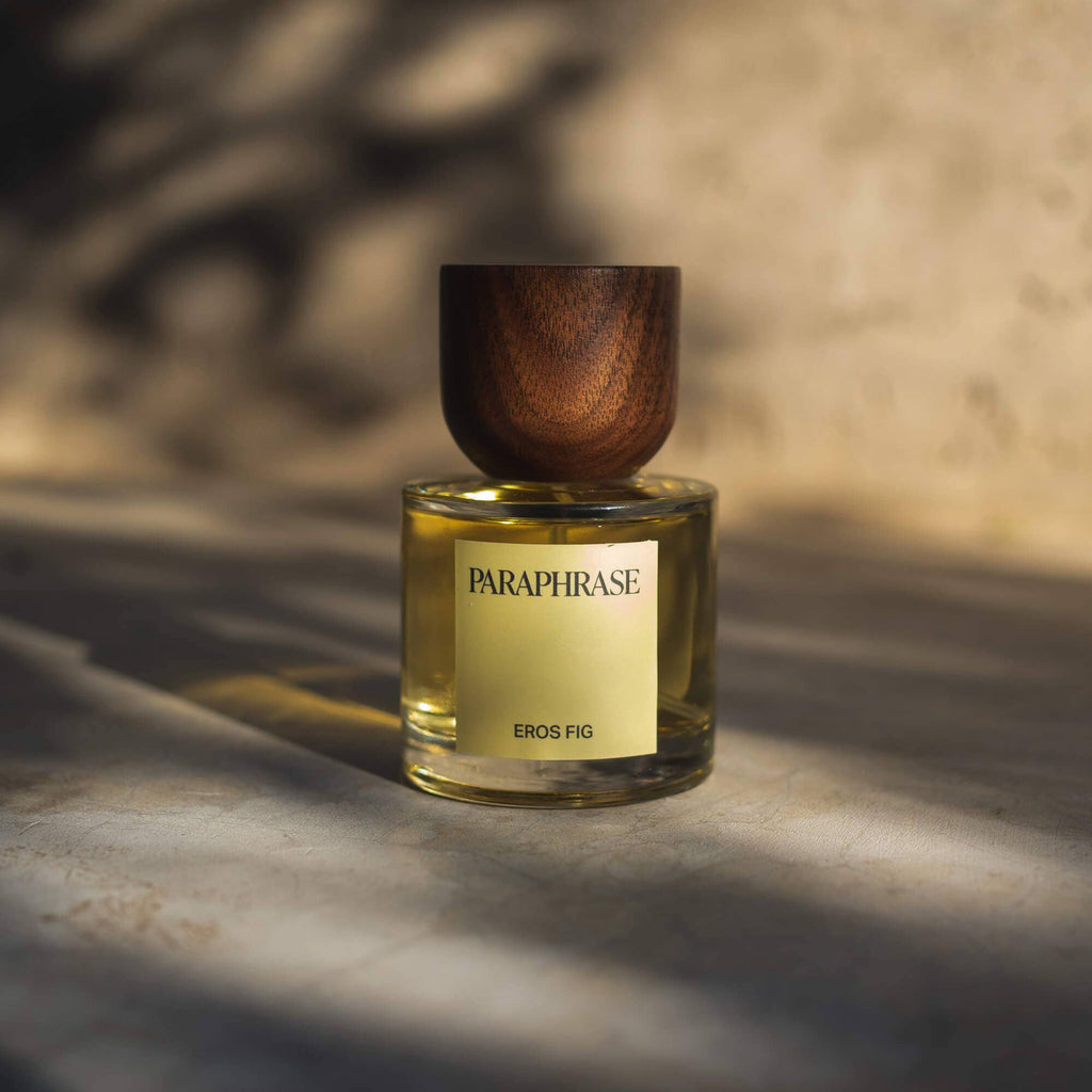 Paraphrase Eros Fig golden-yellow perfume bottle side angle studio shot