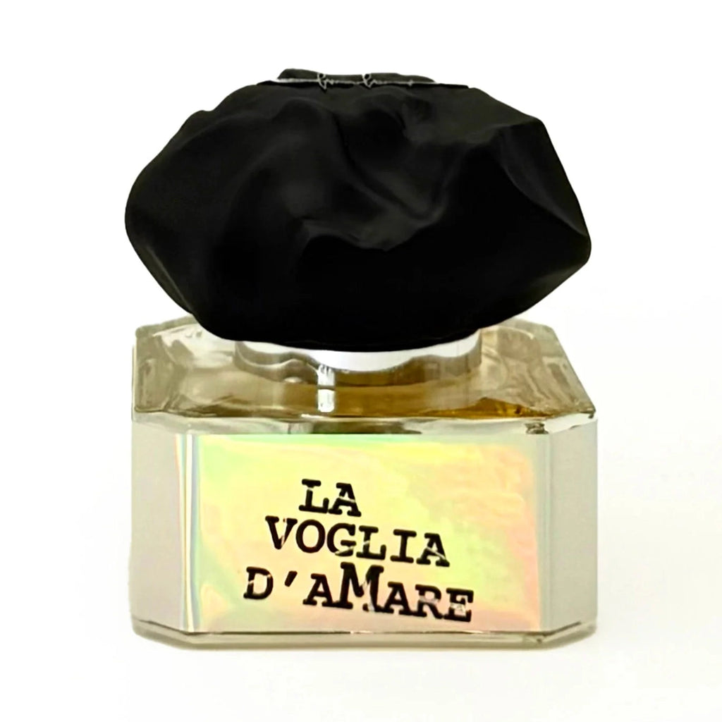 Front view of Filippo Sorcinelli La Voglia D'Amare Extrait de Parfum in faceted clear glass with golden liquid and black textured cap
