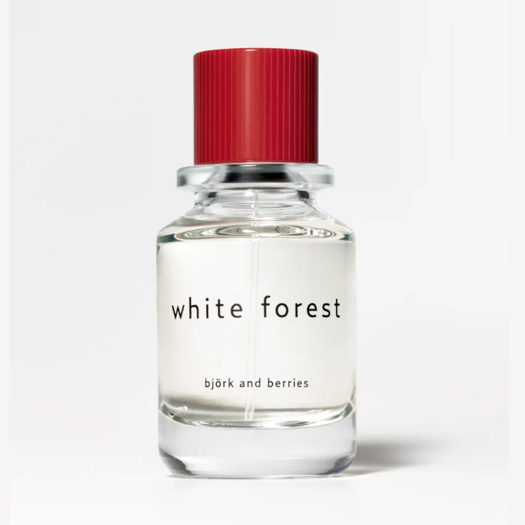 Bjork and Berries White Forest Eau de Parfum in clear glass bottle with red ribbed cap