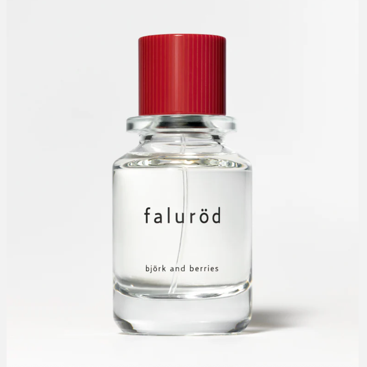 Björk and Berries Faluröd Eau de Parfum in clear glass bottle with red ribbed cap