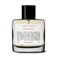 Kismet Olfactive Nostalgia Eau de Parfum in transparent glass bottle with black cap and amber liquid