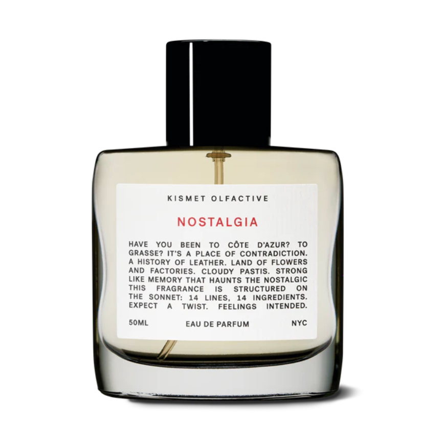 Kismet Olfactive Nostalgia Eau de Parfum in transparent glass bottle with black cap and amber liquid